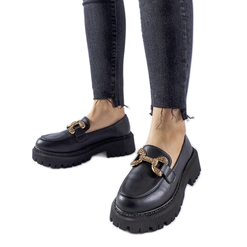Black loafers decorated with Uzzone rhinestones