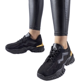 Black sneakers with a massive Gironic sole