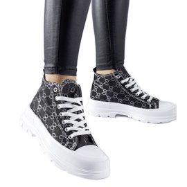 Black sneakers decorated with the Terenzio monogram