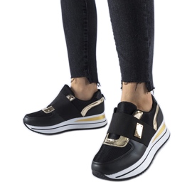 Black slip-on sneakers with the Sages platform