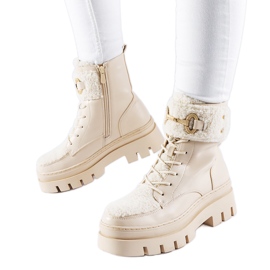 Beige insulated workers' boots with a Highland buckle