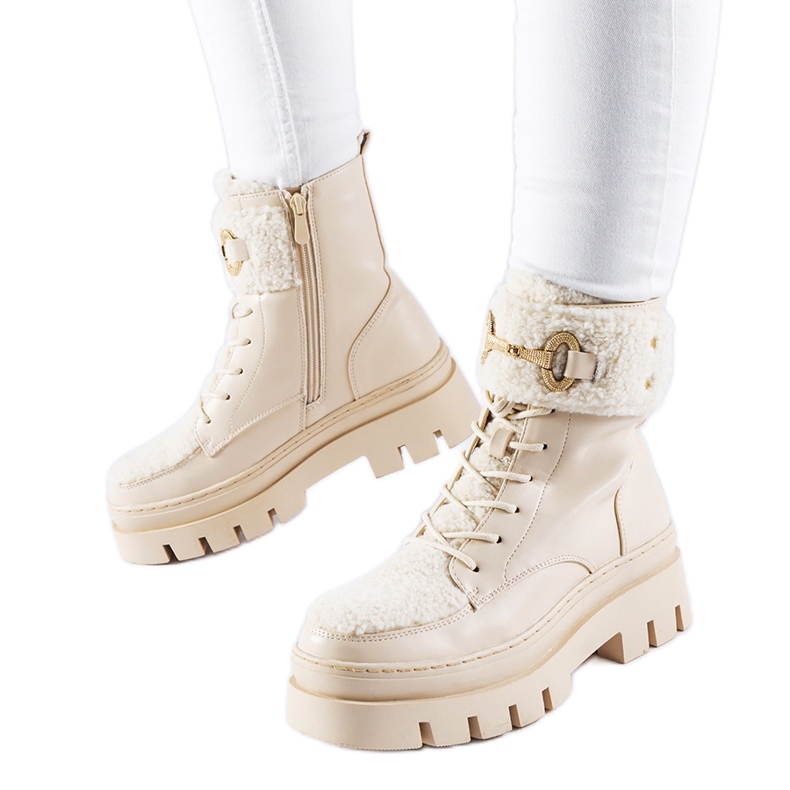 Beige insulated workers' boots with a Highland buckle