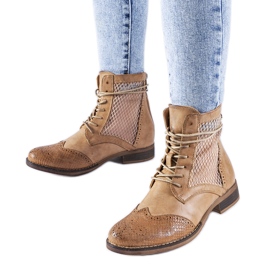 Brown openwork flat boots from Reeves Brown openwork flat boots from Reeves