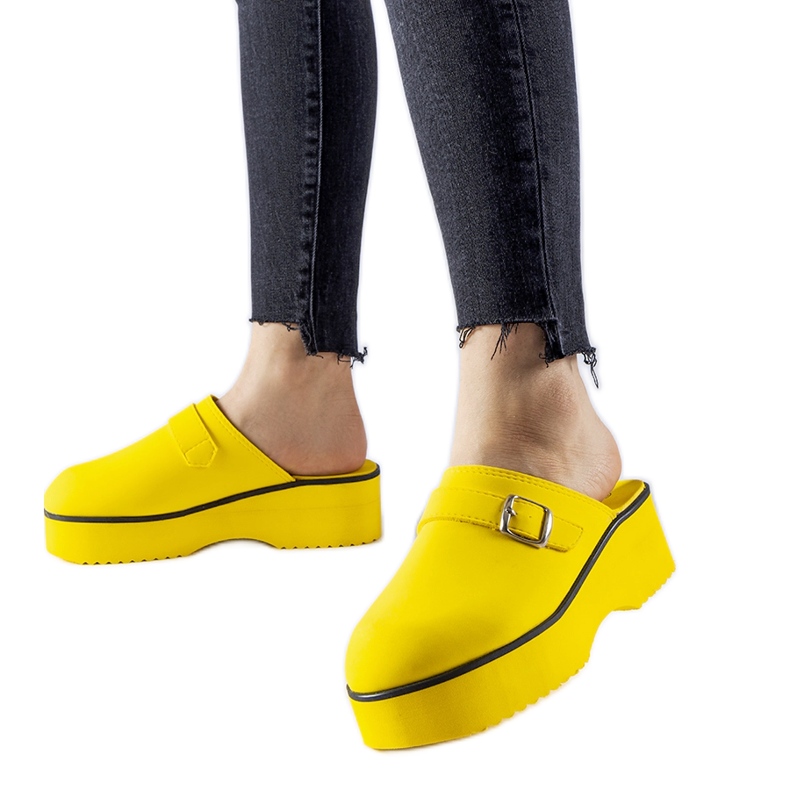 Yellow clog slides on the Lang platform