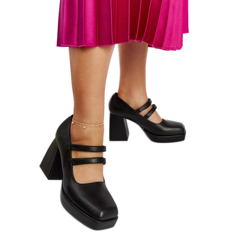 Cher black pumps with a massive block heel