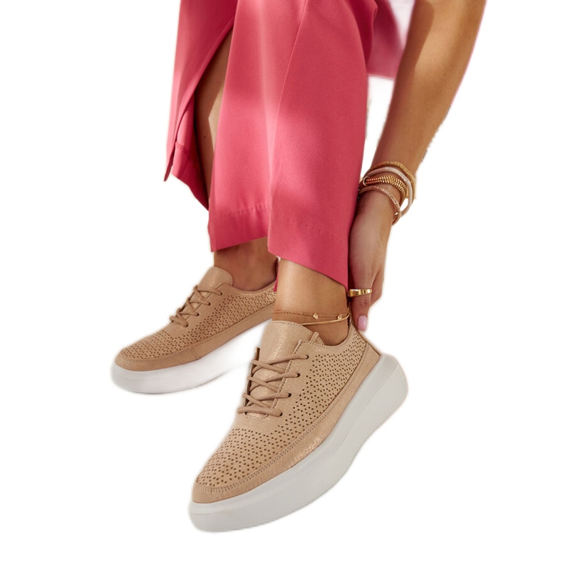 Lori's gold platform sneakers golden