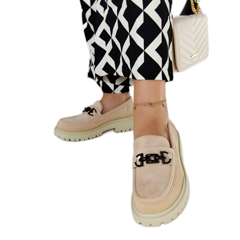 Beige suede loafers with a Lyle buckle