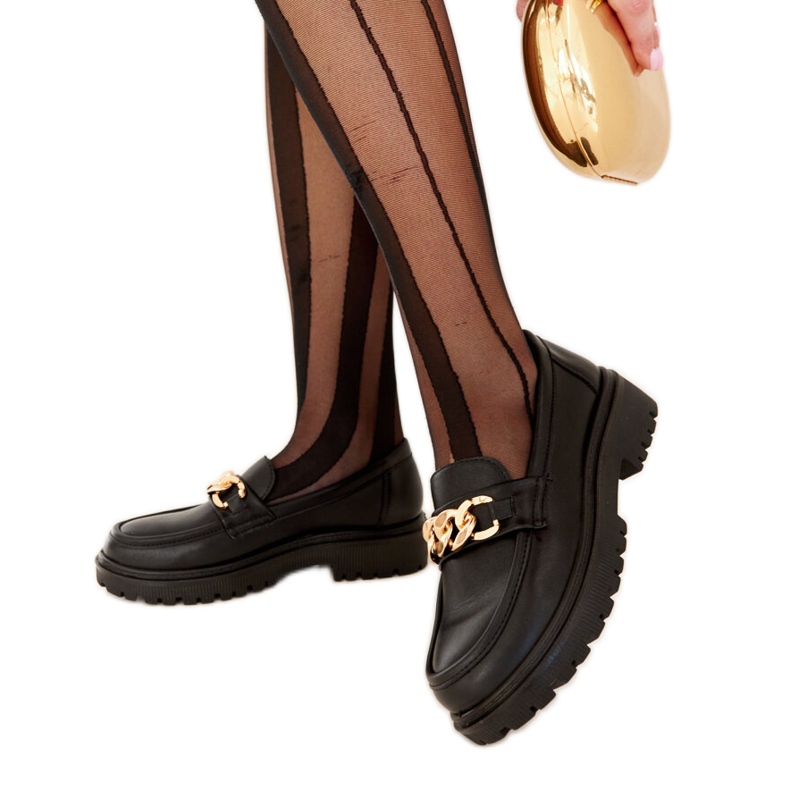Black loafers on Elenor