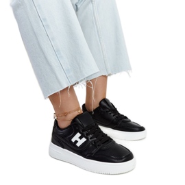 Black sneakers on a white Mentha platform