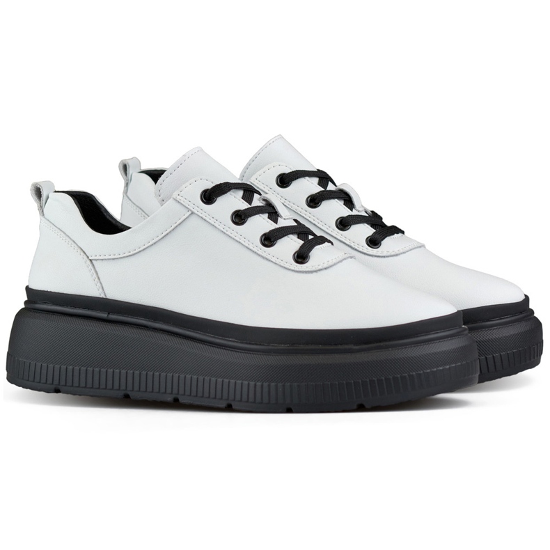 Women's white leather sneakers with a black sole
