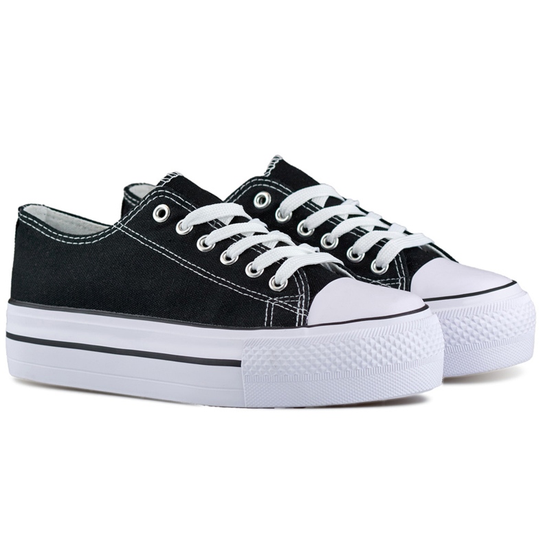 Black sneakers with a thick sole, classic women's sneakers on the platform