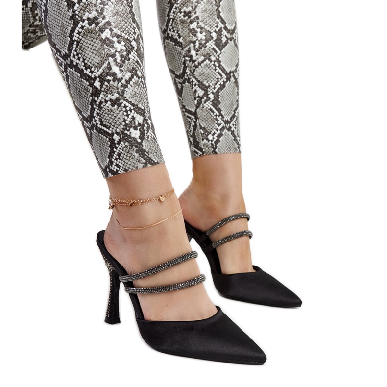 Black high-heeled flip-flops by Raffaelina