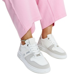 White and gray sneakers on the Negisti platform
