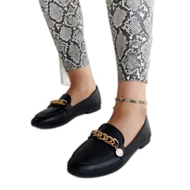 Black loafers with a Scaletta chain