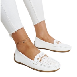 White moccasins with a decorative buckle by Adila