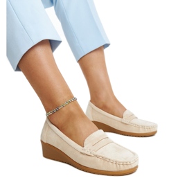 Light beige suede wedge loafers by Sakena