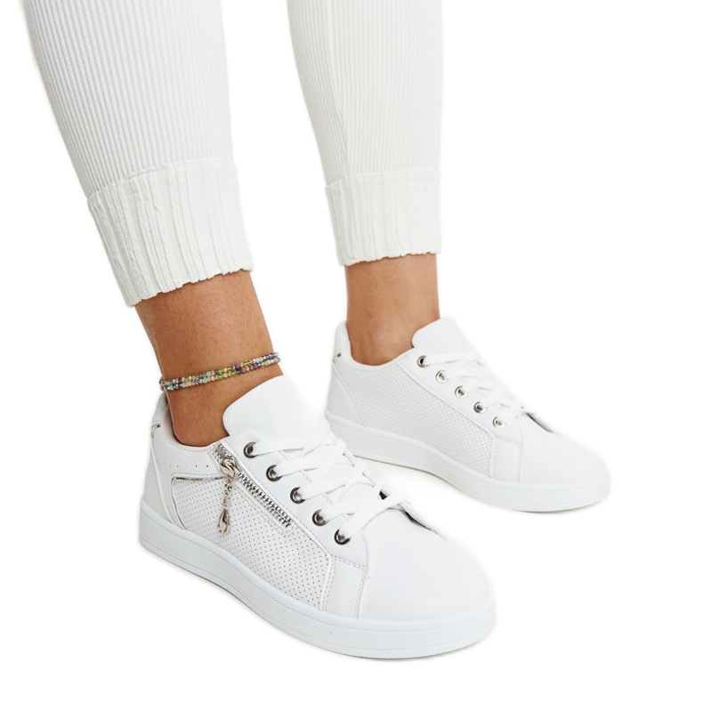 White sports shoes decorated with Chiusi perforation