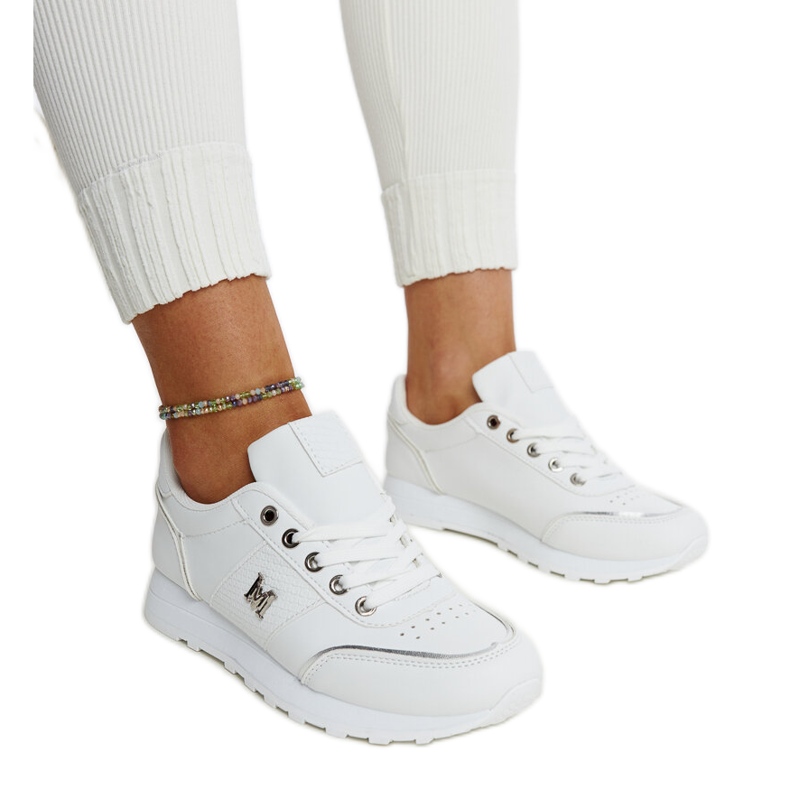 White sneakers with a thick Kincheloe sole