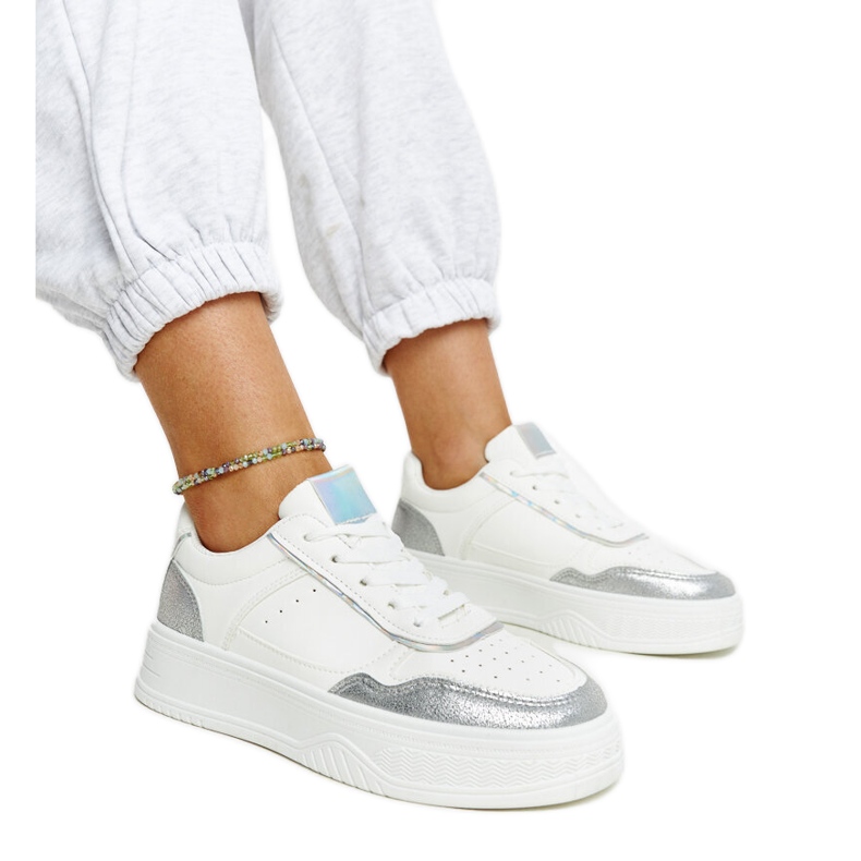 White and silver sneakers with a thick Rumai sole