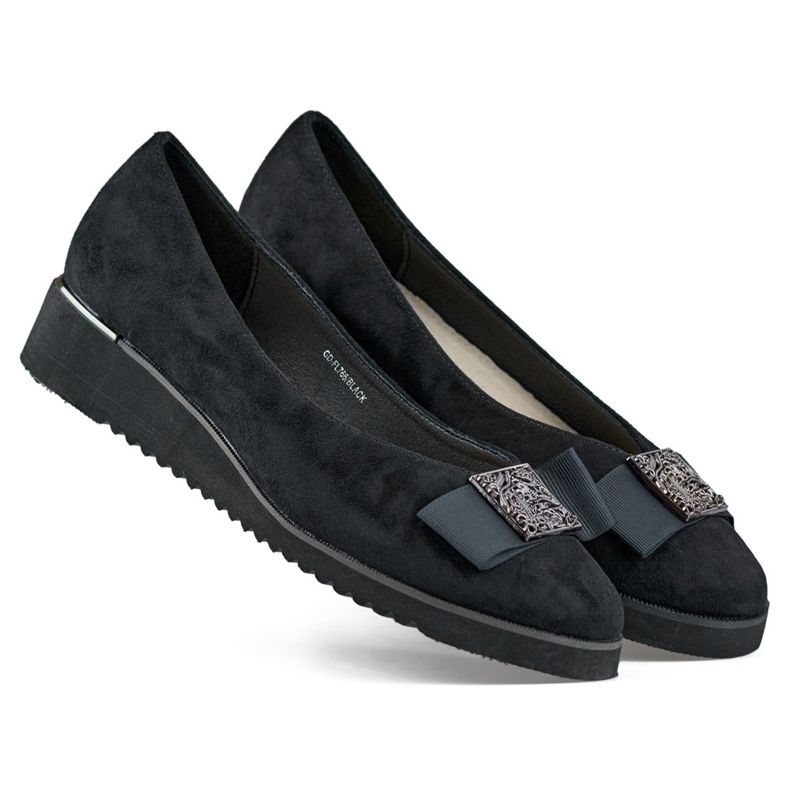 Black suede pumps with a low wedge