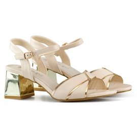 Elegant beige women's sandals with a gold heel