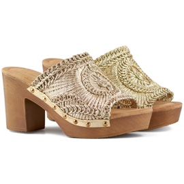 Lace gold women's slippers on a high heel with a sole imitating wood golden