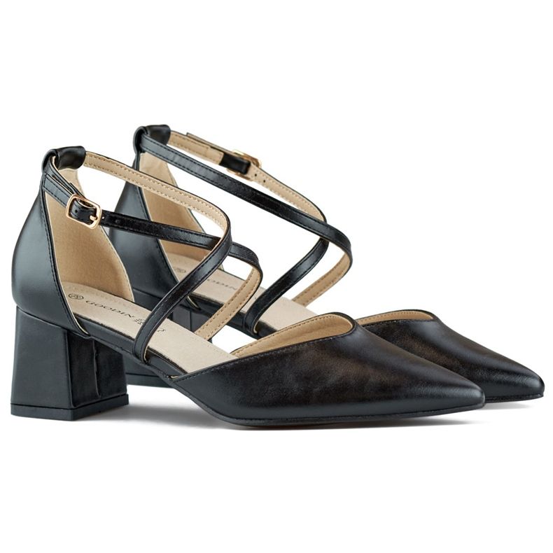 Black pumps with straps on a low heel