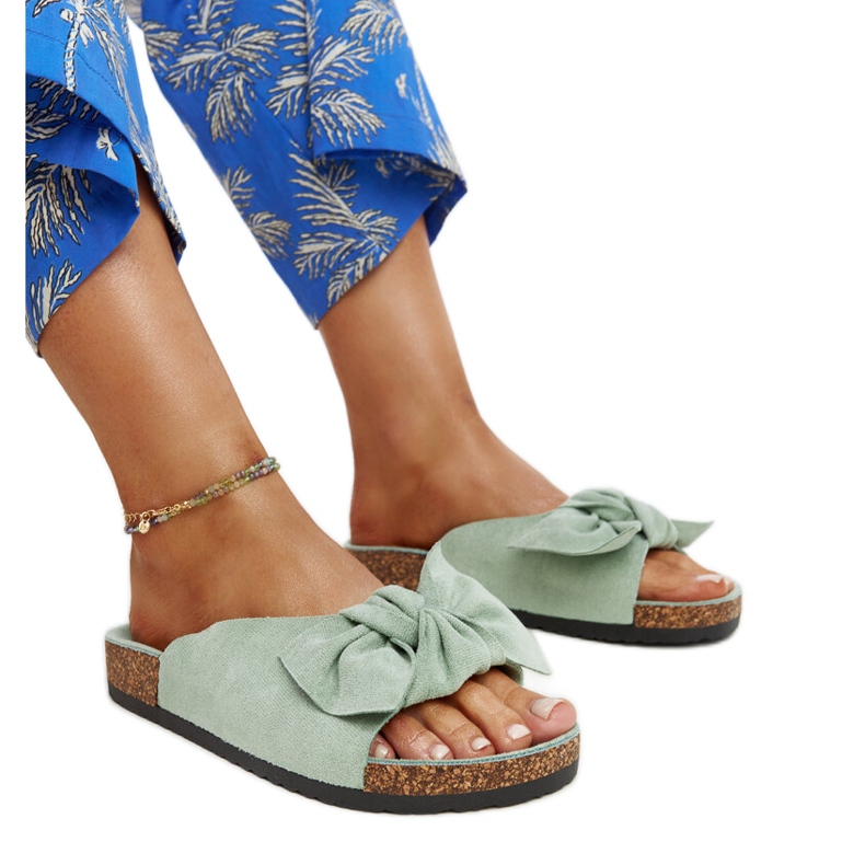 Light green Aamu slides with a cork sole