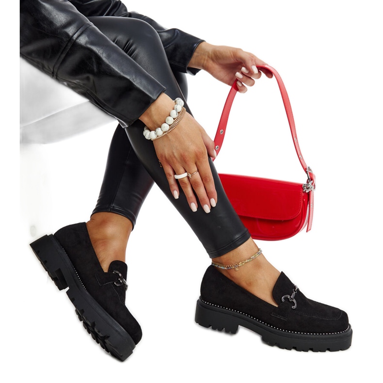 Black leather shoes with a decorative buckle