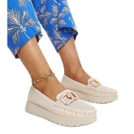 Beige leather shoes with a decorative buckle