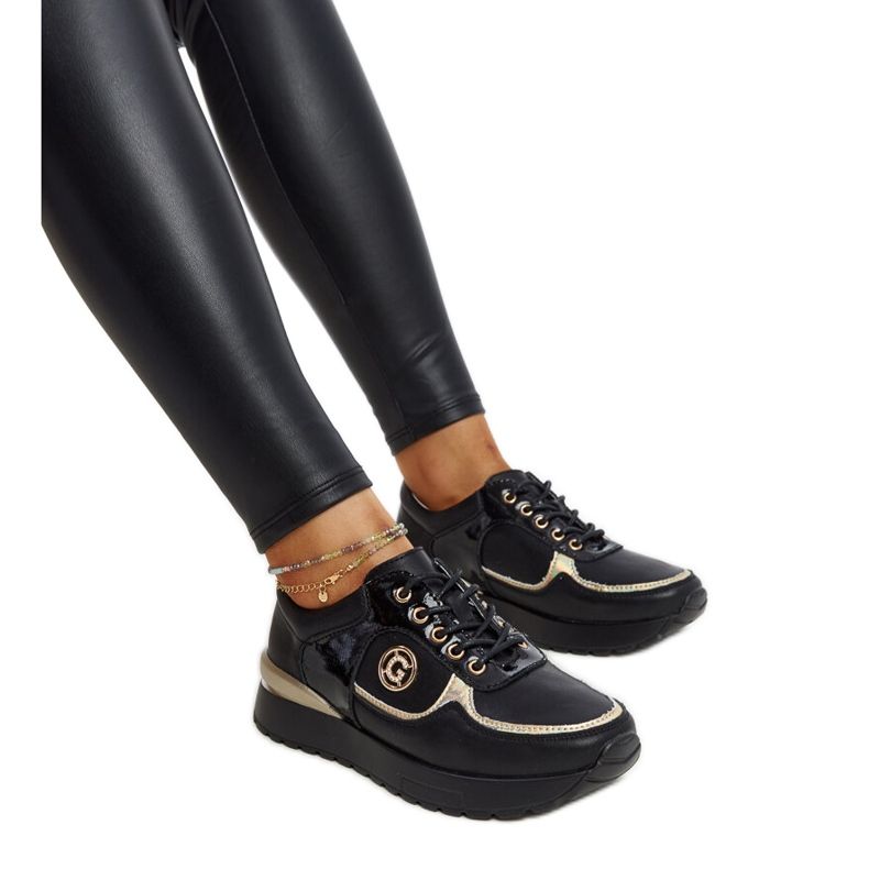 Black leather shoes with a decorative buckle