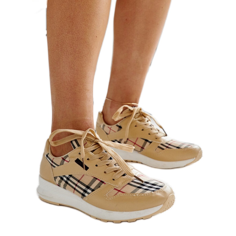 Beige leather shoes with a decorative buckle