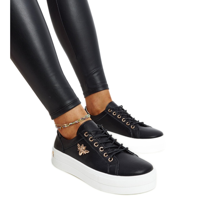 Black leather shoes with a decorative buckle