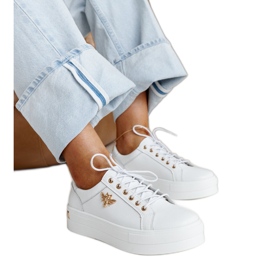 White leather shoes with a decorative buckle