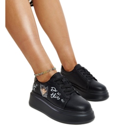 Black leather shoes with a decorative buckle