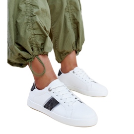 White and black sneakers with a decorative Grada stripe White and black sneakers with a decorative Grada stripe