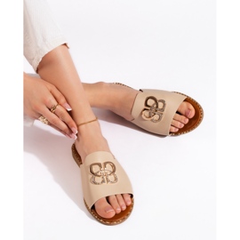 Stylish beige women's flip-flops
