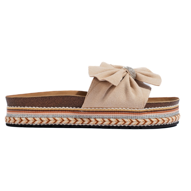 Beige suede slides with a bow