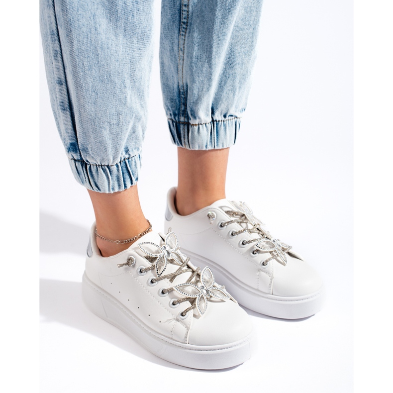 White sports shoes with butterflies