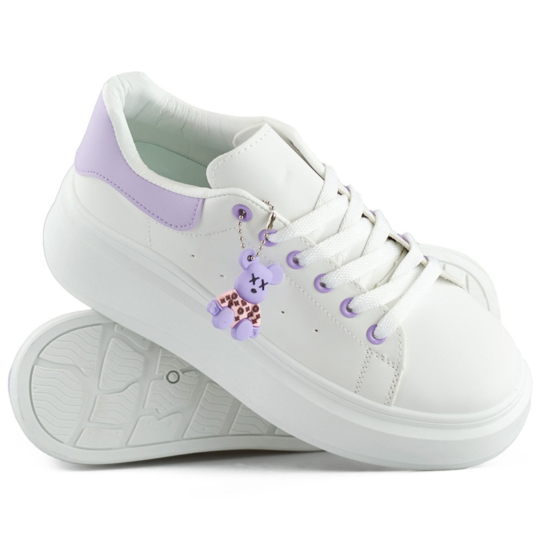 White sports shoes with a thick sole and a purple teddy bear
