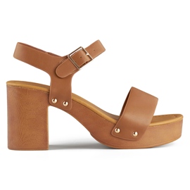Brown sandals with a wooden platform heel