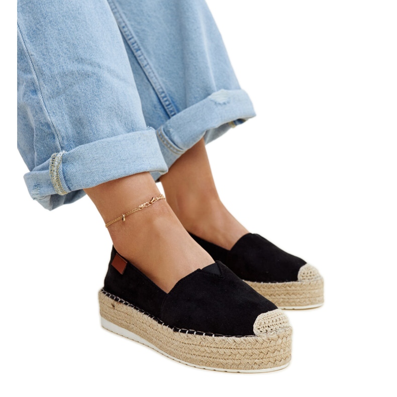 Black espadrilles with a high Masia platform