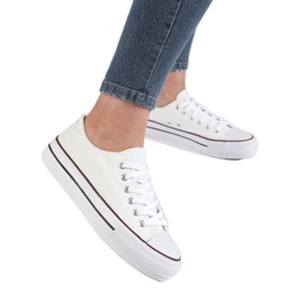 Women's white sneakers on the platform