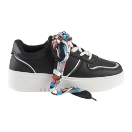 Black women's sneakers tied with a ribbon Black women's sneakers tied with a ribbon