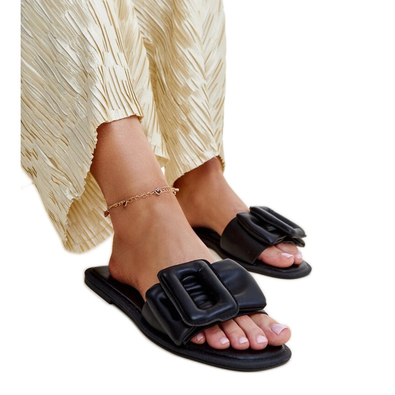 Black flip-flops with a Ganema buckle