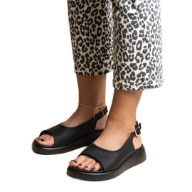 Black sandals with a thick Hamond sole