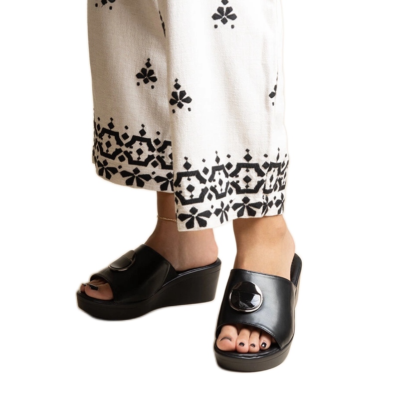 Black wedge mules with a Keirenh buckle