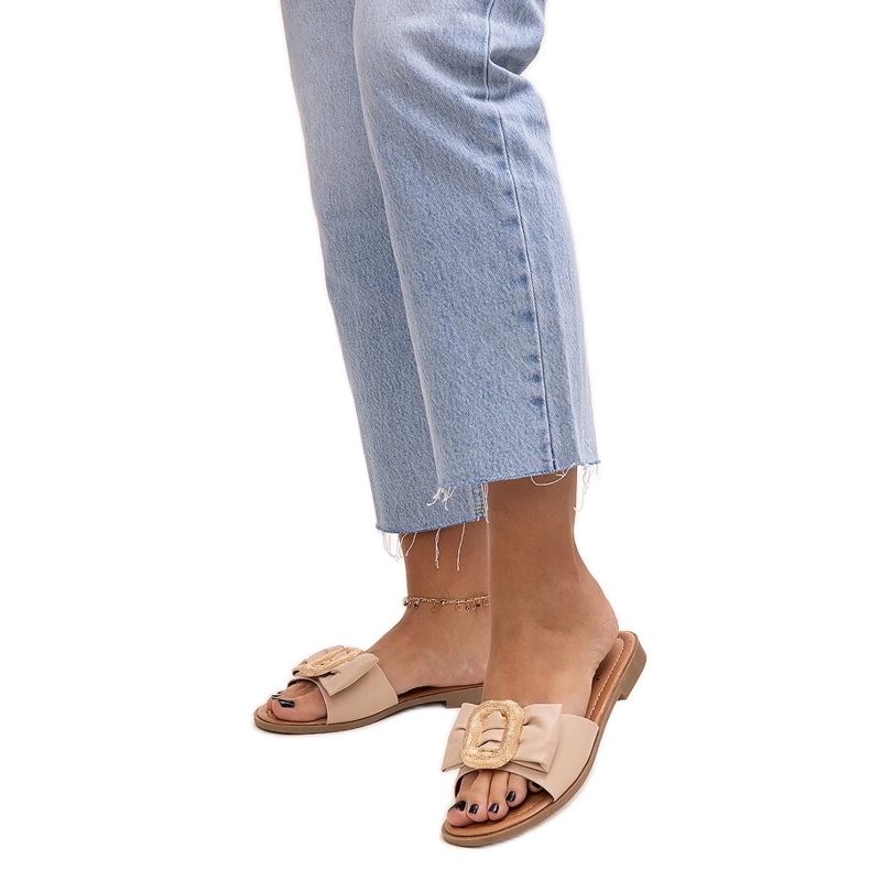 Beige flip-flops with a Limera buckle