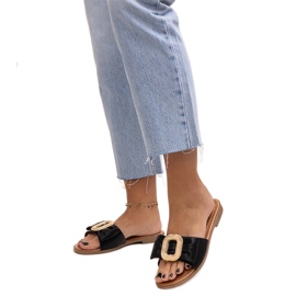 Black flip-flops with a Limera buckle