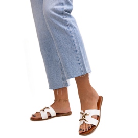 White flip-flops with a Razanna buckle